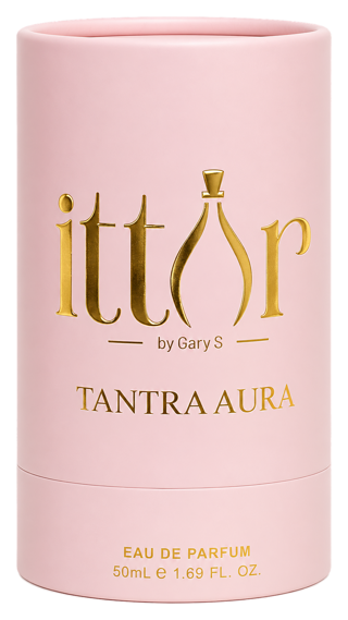 Tantra Aura gift box, a pink cylindrical case stamped with the ittar logo in gold